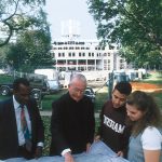 While construction of the new library is under way, Father O’Hare reviews the floor plan with student leaders.