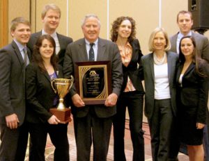 John Feerick (LAW ’61), former dean of Fordham Law, poses with the national-champion mediation team of Fordham’s Dispute Resolution Society.