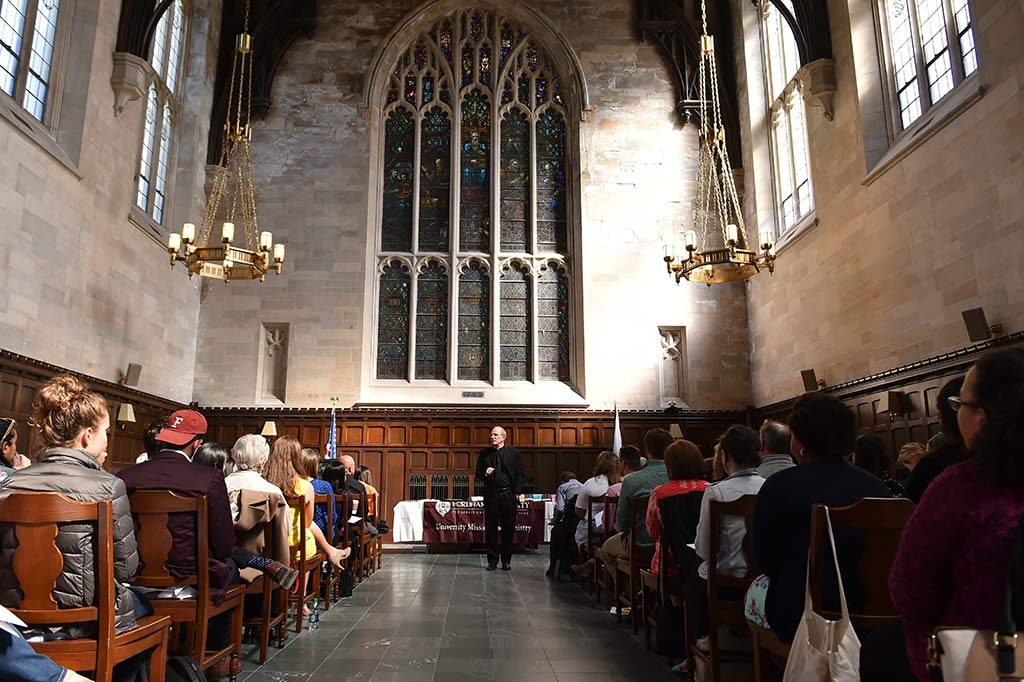 Father McShane addresses attendees at Tognino Hall.Photos by Dana Maxson