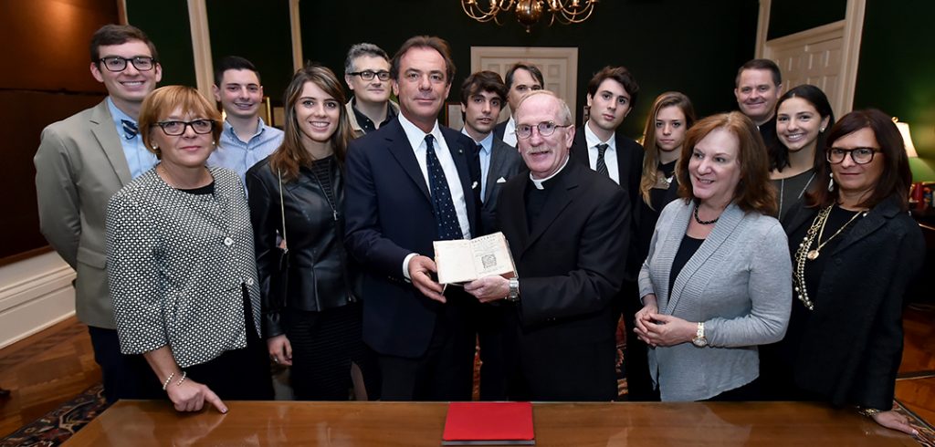 Longhi give anti-Machiavelli book to Father McShane