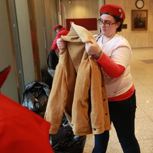 Borghard inspects donated jacket