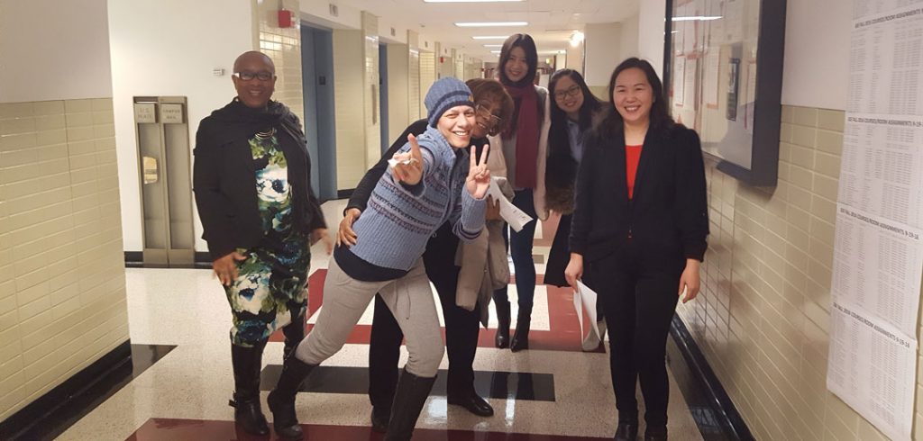 Lissette Olmeda, second left, poses with colleagues from the Graduate School of Education.