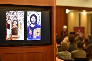 Byzantine art projected onto a screen in the 12th floor lounge