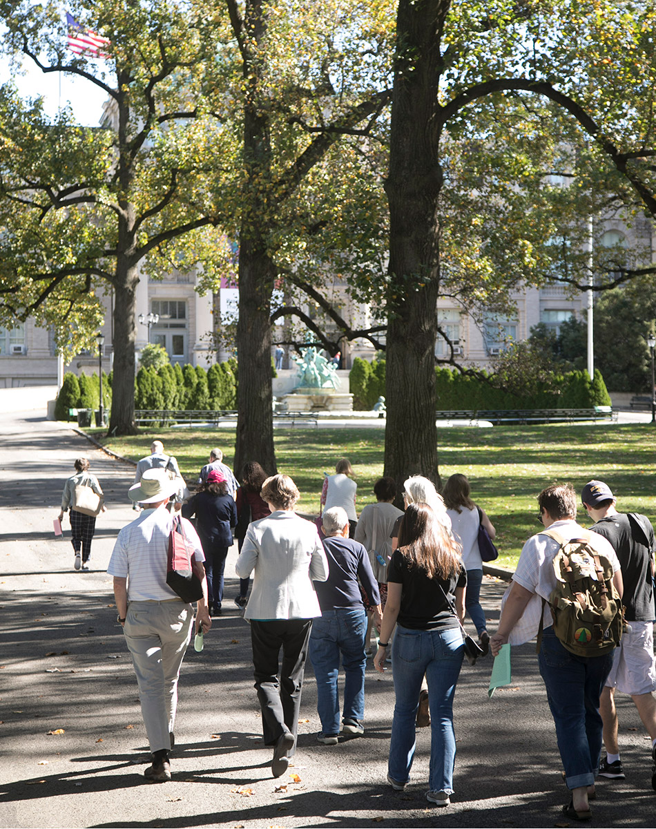 A student and alumni tour group at the New York Botanical Garden