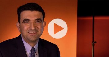 Mohammad Nejad on Data Breaches A man smiling in front of an orange screen