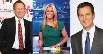Three members of the media smile