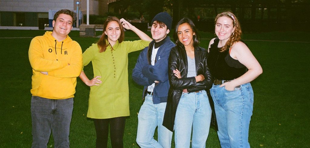 Students smile and pose for a photo