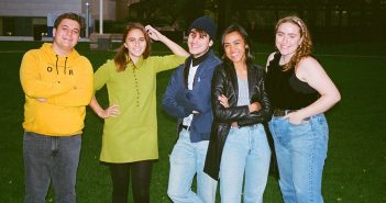 Students smile and pose for a photo