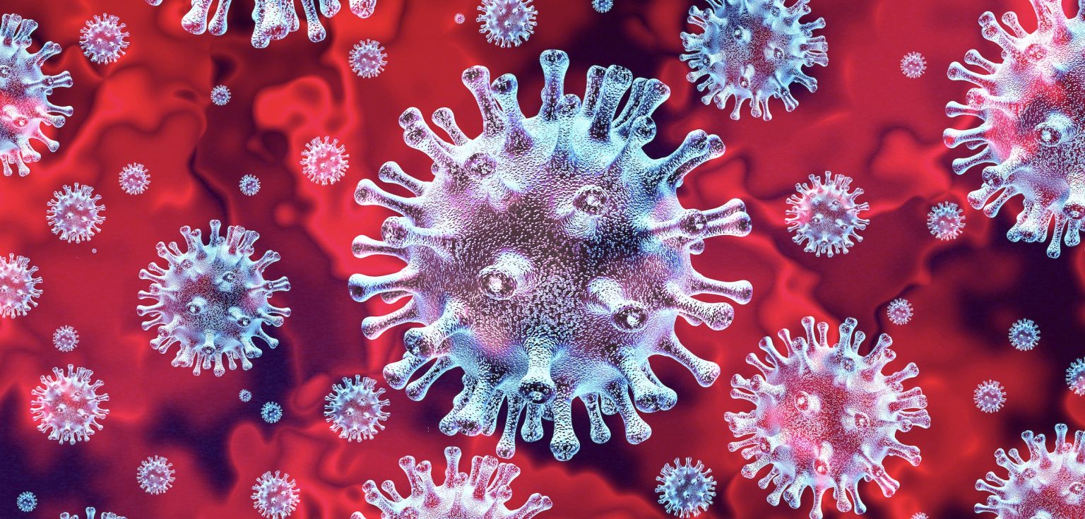 A microscopic coronavirus against a red background