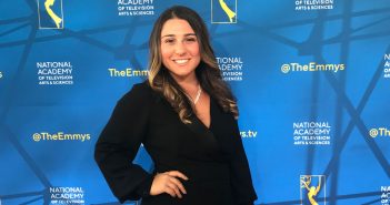 A girl poses for a picture after winning an award