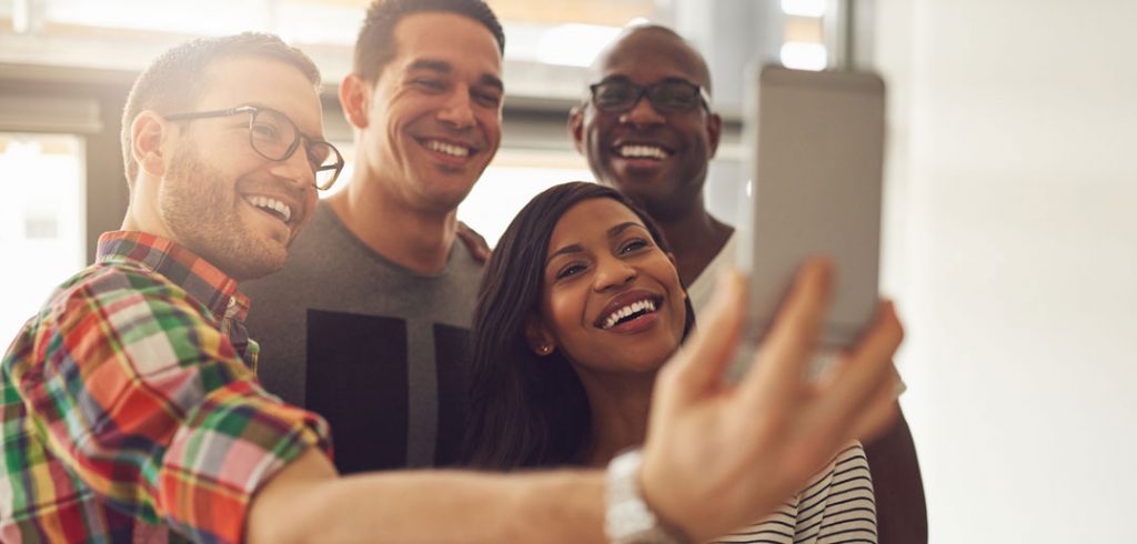 People pose for a selfie