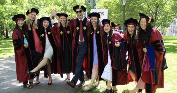 A group of GSE graduates posing together.
