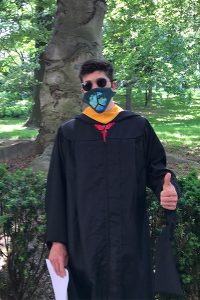 Brandon LaBella, a 2021 GSE graduate, posing with trees in the background.