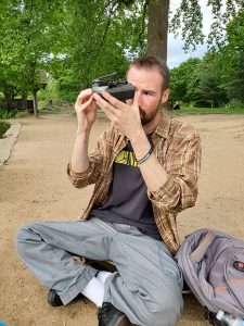 Michael Kausch holding a microscope