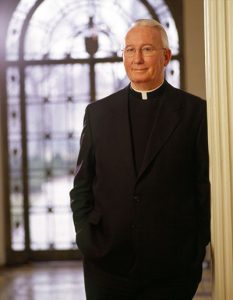 Father O'Hare standing in collar