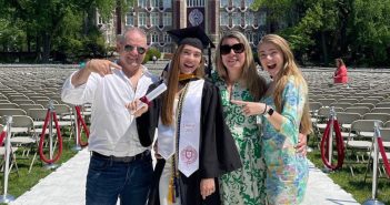 Tiffany Ferreira poses with her father, mother, and sister on Edwards Parade at Fordham's Rose Hill campus