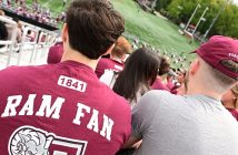 Two men watch football