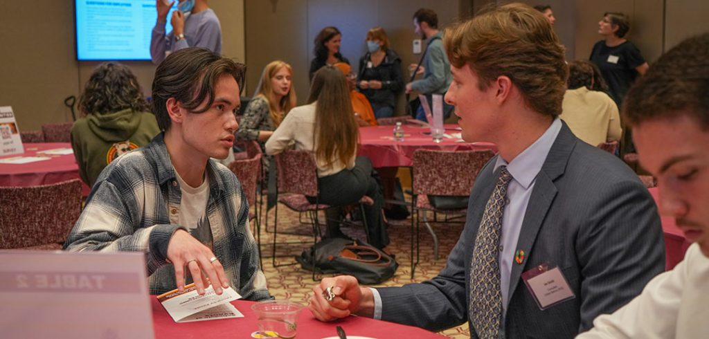 two people talking at a table