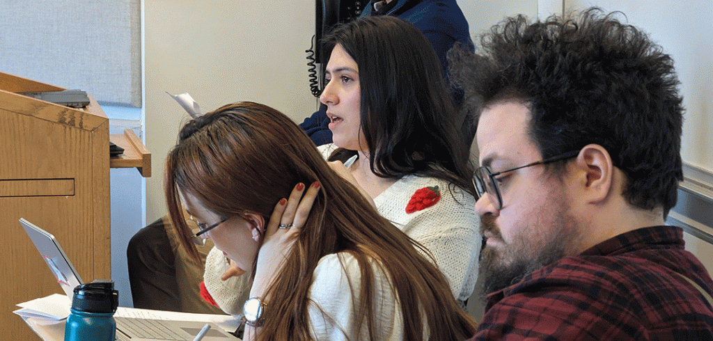 three students sitting together