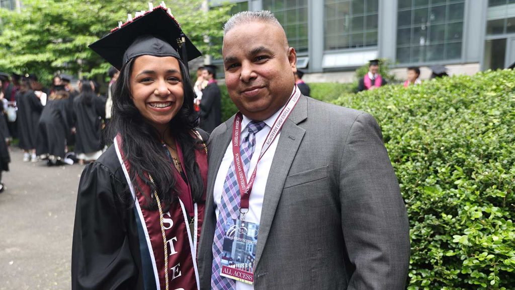 Katelyn Figueroa in cap and gown with Richard Figueroa