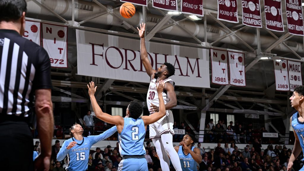 Abdou Tsimbila leaps over the defense for a rebound.