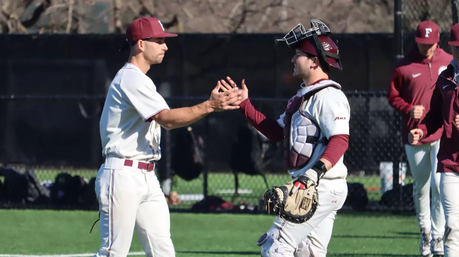 Connor Haywood & Carson Chavez high five after closing out a 9-6 win.