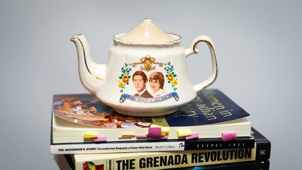 A white teapot imprinted with Prince Charles and Princess Diana from the British monarchy