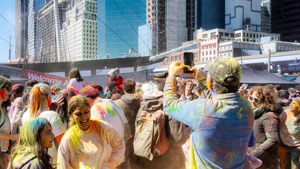 5 Things to Do in NYC | March Holi festival, colored powder and participants smiling
