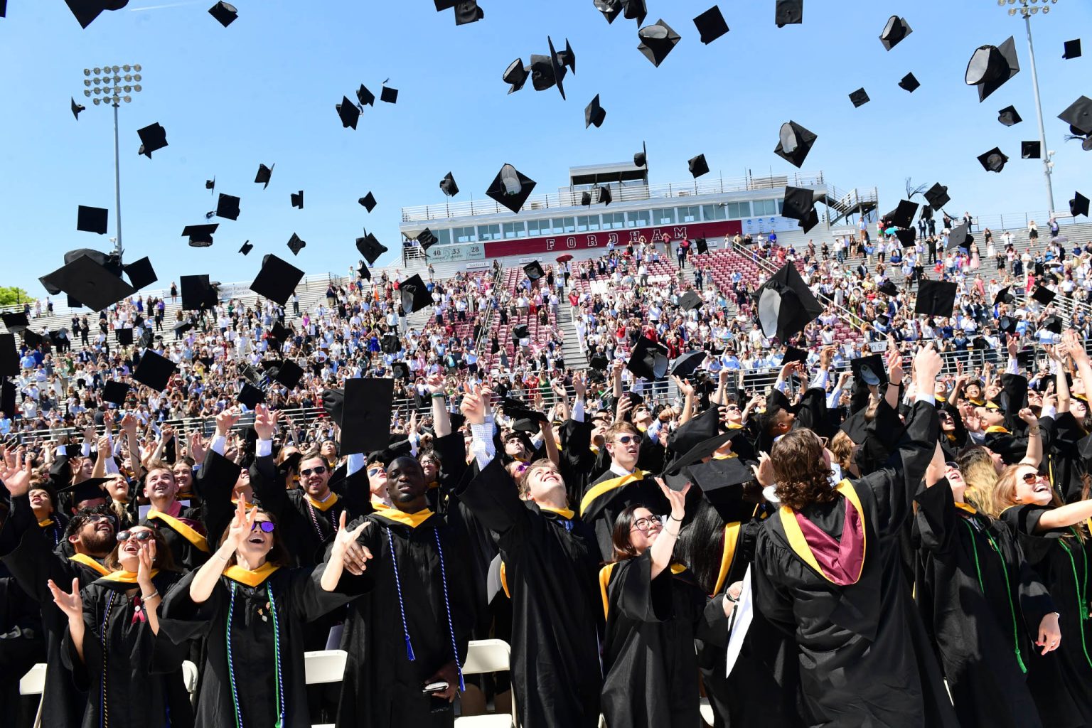 Graduates throwing their caps in the air