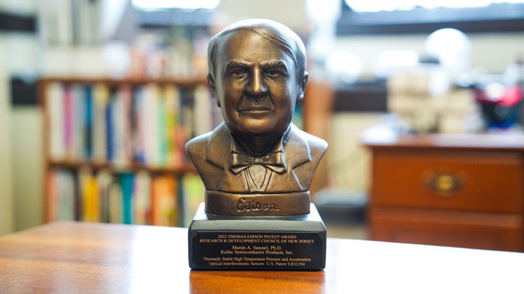 A bust of Thomas Edison's head on a desk