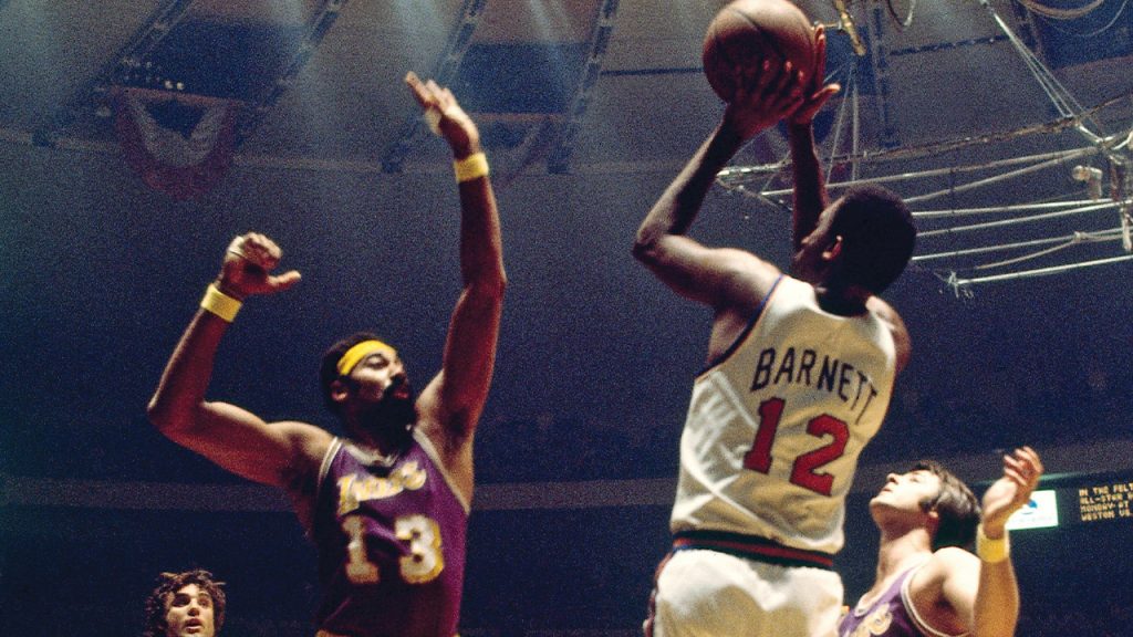 Dick Barnett shoots over Wilt Chamberlain at Madison Square Garden in 1972.