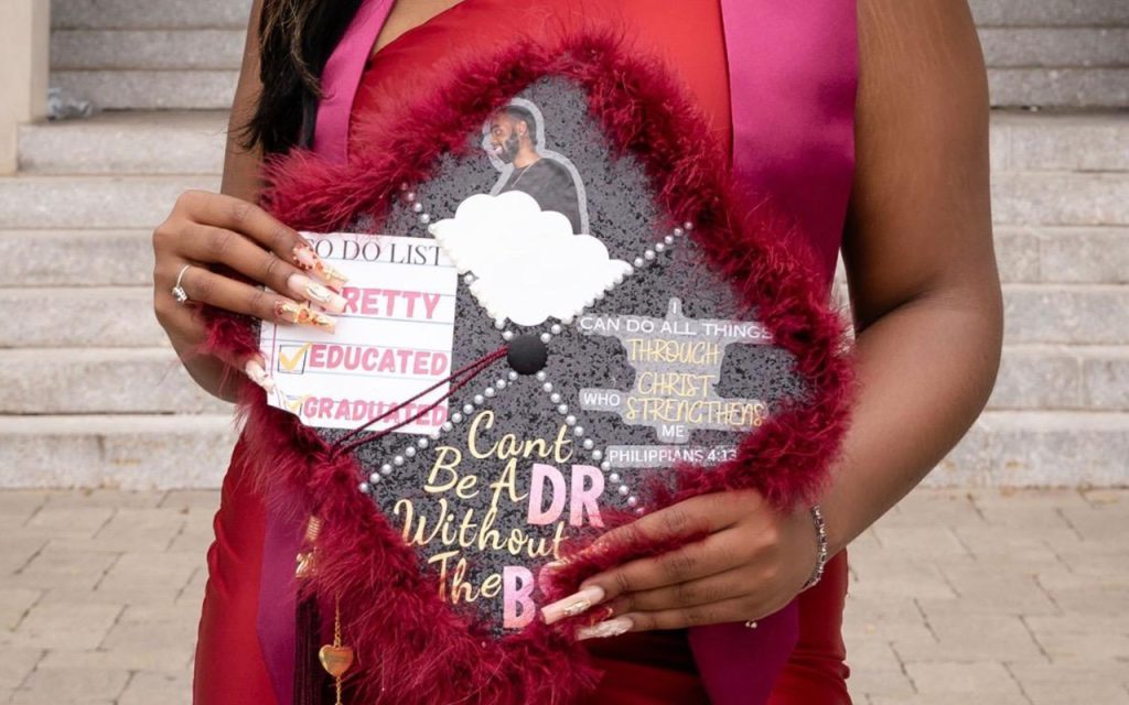 Commencement cap decorated with the messages "To do list: pretty, educated, graduated"; "I can do all things through Christ who strengthens me, Philippians 4:13"; and "Can't be a DR without the BS"