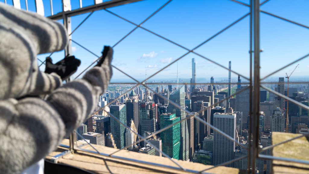 Ramses waves to Manhattan from the top of the Empire State Building.