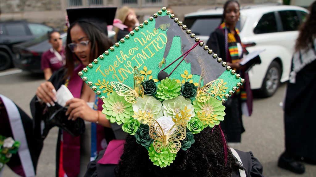 Commencement cap decorated with the message "Together We're Unlimited"