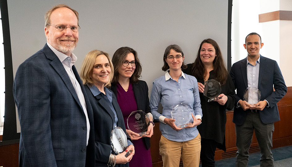 Fordham Provost Dennis Jacobs with faculty members who received distinguished research awards