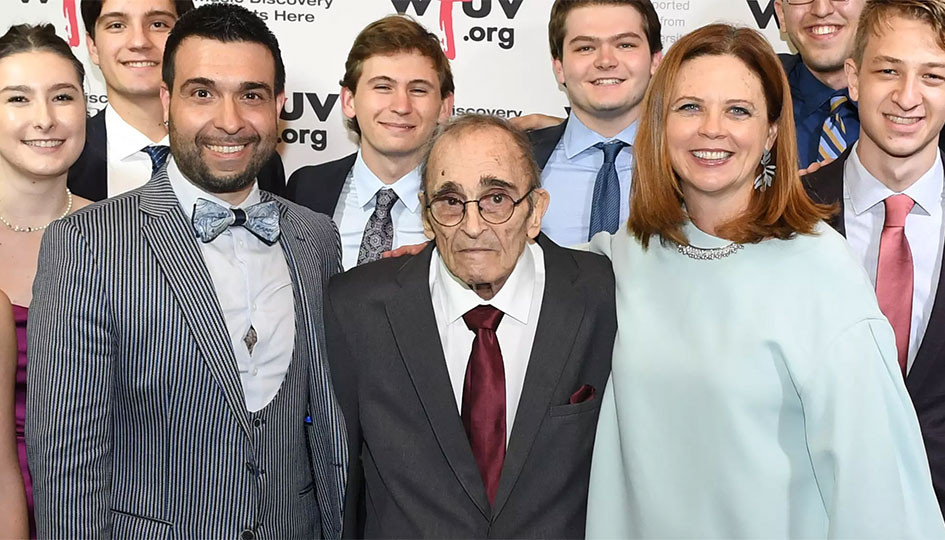 A group of people standing around Bob Ahrens