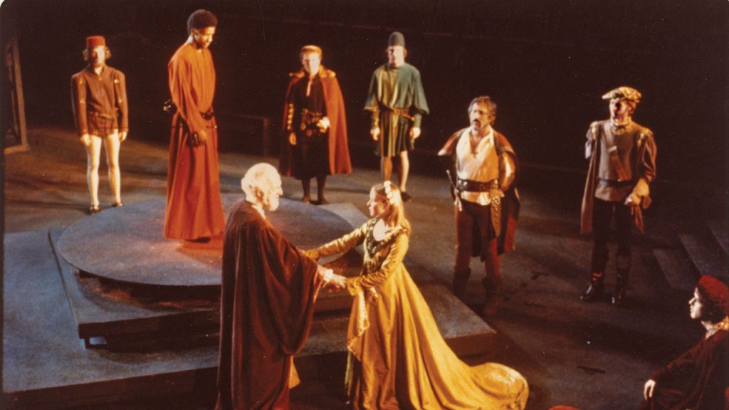 The cast of Othello performs on stage in Pope Auditorium