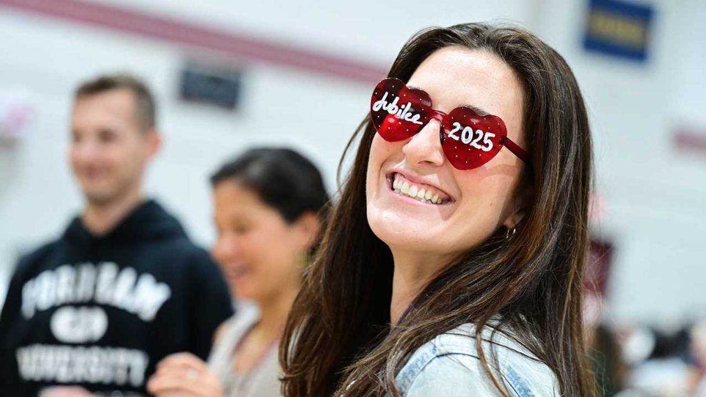 Woman wearing novelty sunglasses Fordham Jubilee