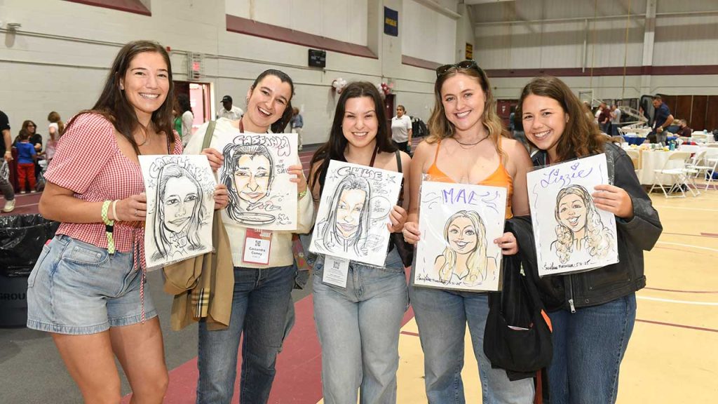 Group of women with caricatures at Fordham Jubilee