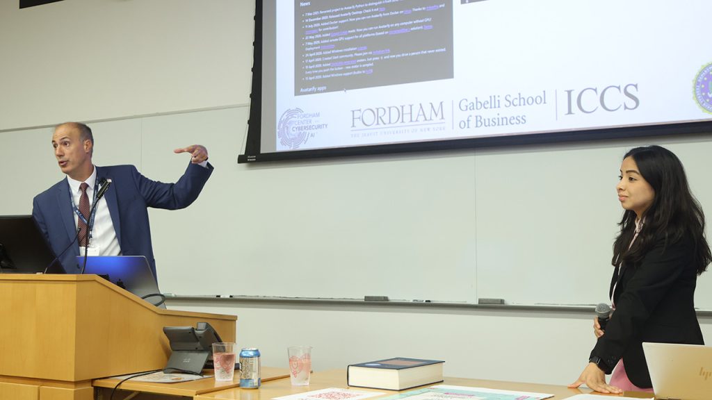 Thaier Hayajneh, director of Fordham's Center for Cybersecurity, and Maria Chano, an AI and cybersecurity strategist at ICF International, giving a presentation