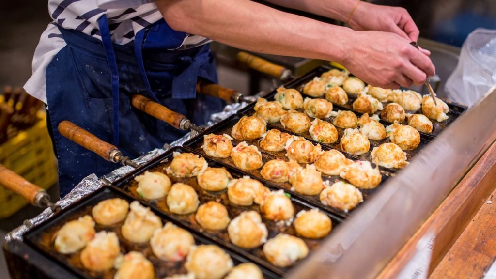 A man cooks Japanese street food representing JAPAN Fes in New York City.