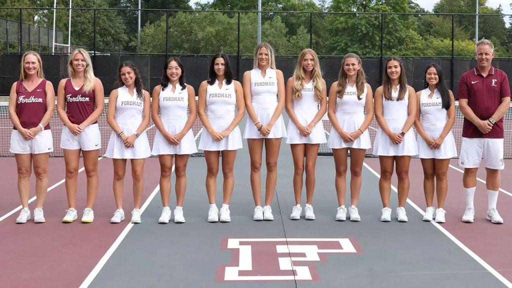 women standing together in tennis uniforms