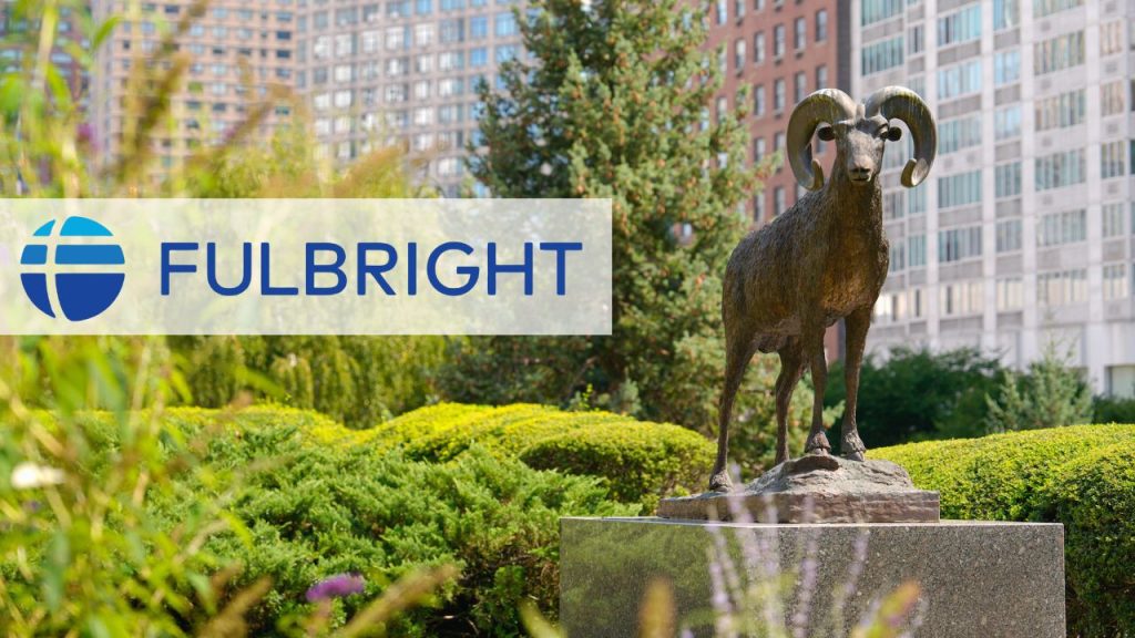 A picture of the ram statue at Fordham's Lincoln Center campus with the Fulbright logo