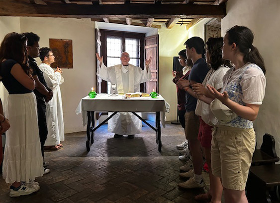 Fordham students attending a Mass being celebrated in the residence of St. Ignatius Loyola