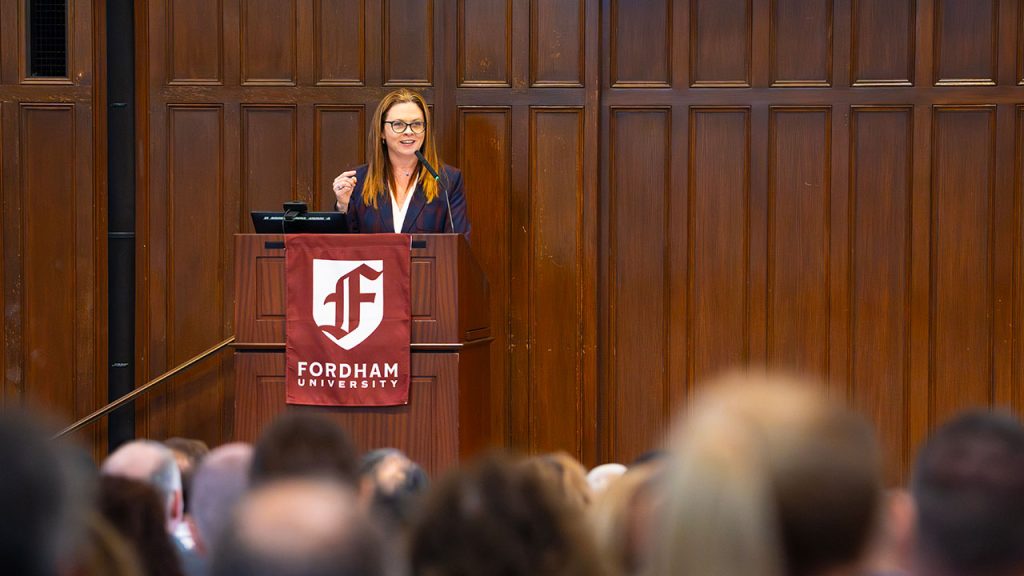 Tania Tetlow standing at a podium on stage