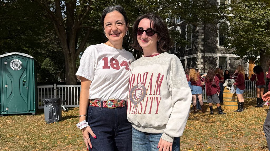 Two girls pose with Fordham gear