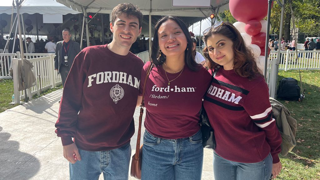Three students pose for a photo