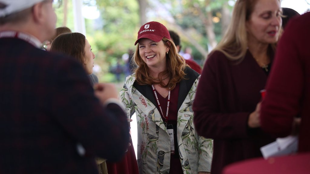 President Tania Tetlow talks to alumni