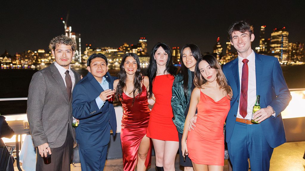 People smile on a yacht cruise around Manhattan
