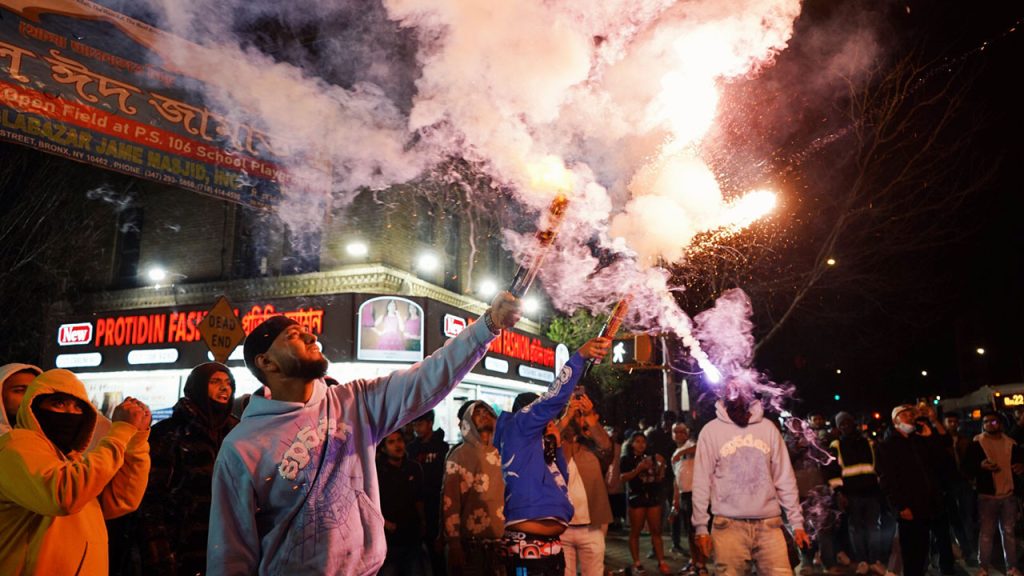 Bronx men outside fireworks at night
